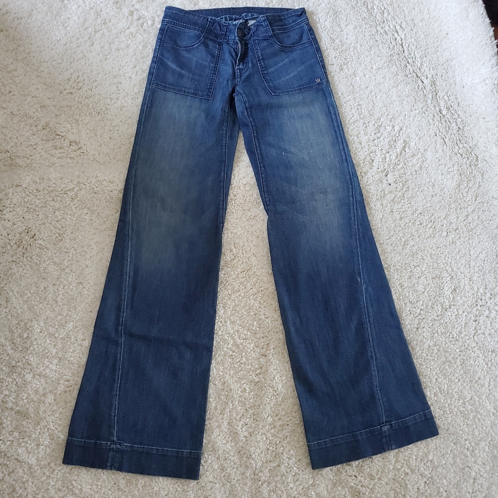Low rise, flare leg jeans by Genetic Denim;